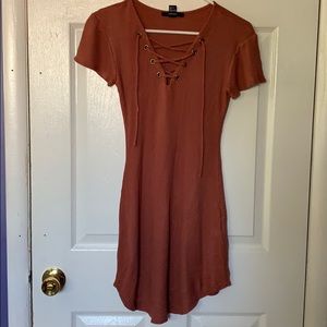 Rust colored, tight- fitting dress